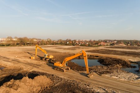 A high angle shot of two excavators on a building site
